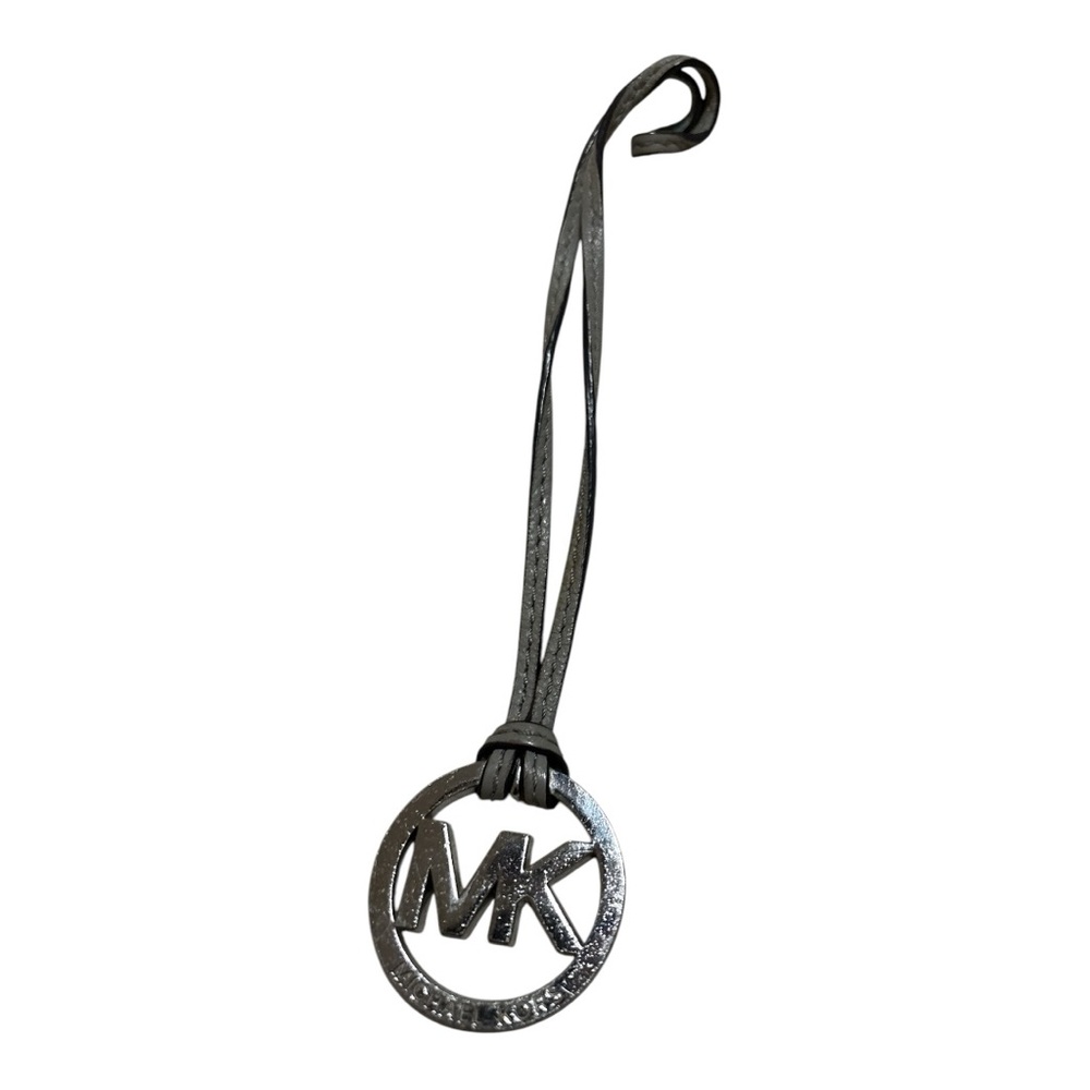 Michael Kors bag charm with gray leather strap
